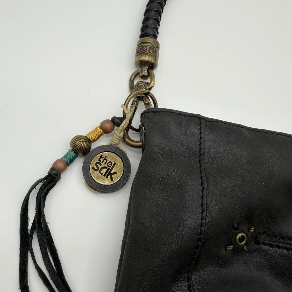The Sak Indio Demi Leather Hobo Bag Braided Strap Whipstitch Charm Logo Black